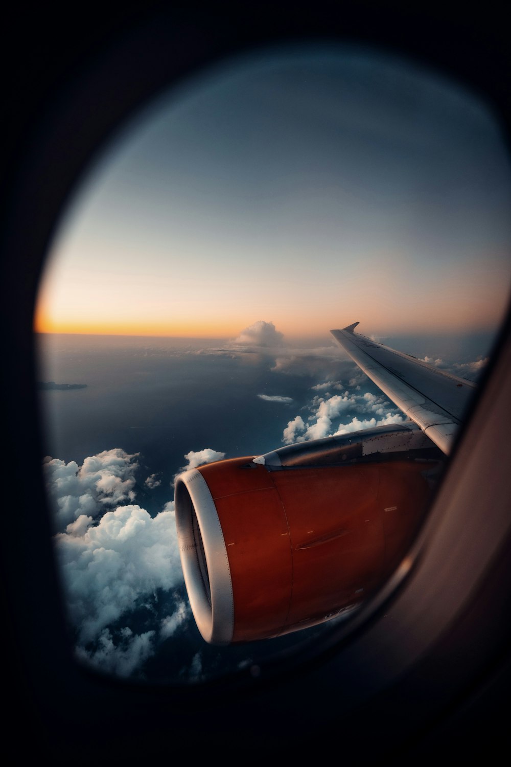 a view of the wing of an airplane in the sky