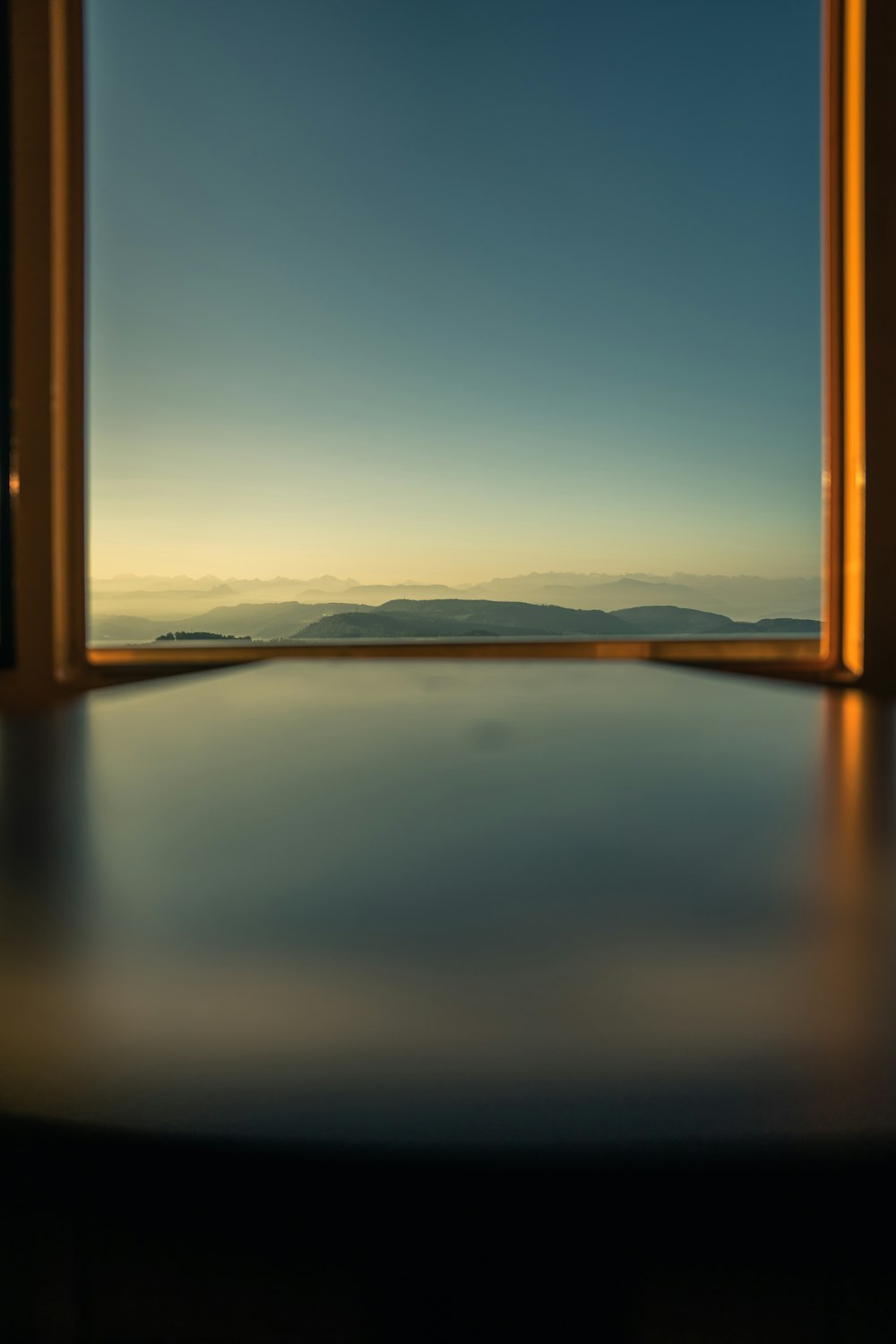 an open window with a view of the sky