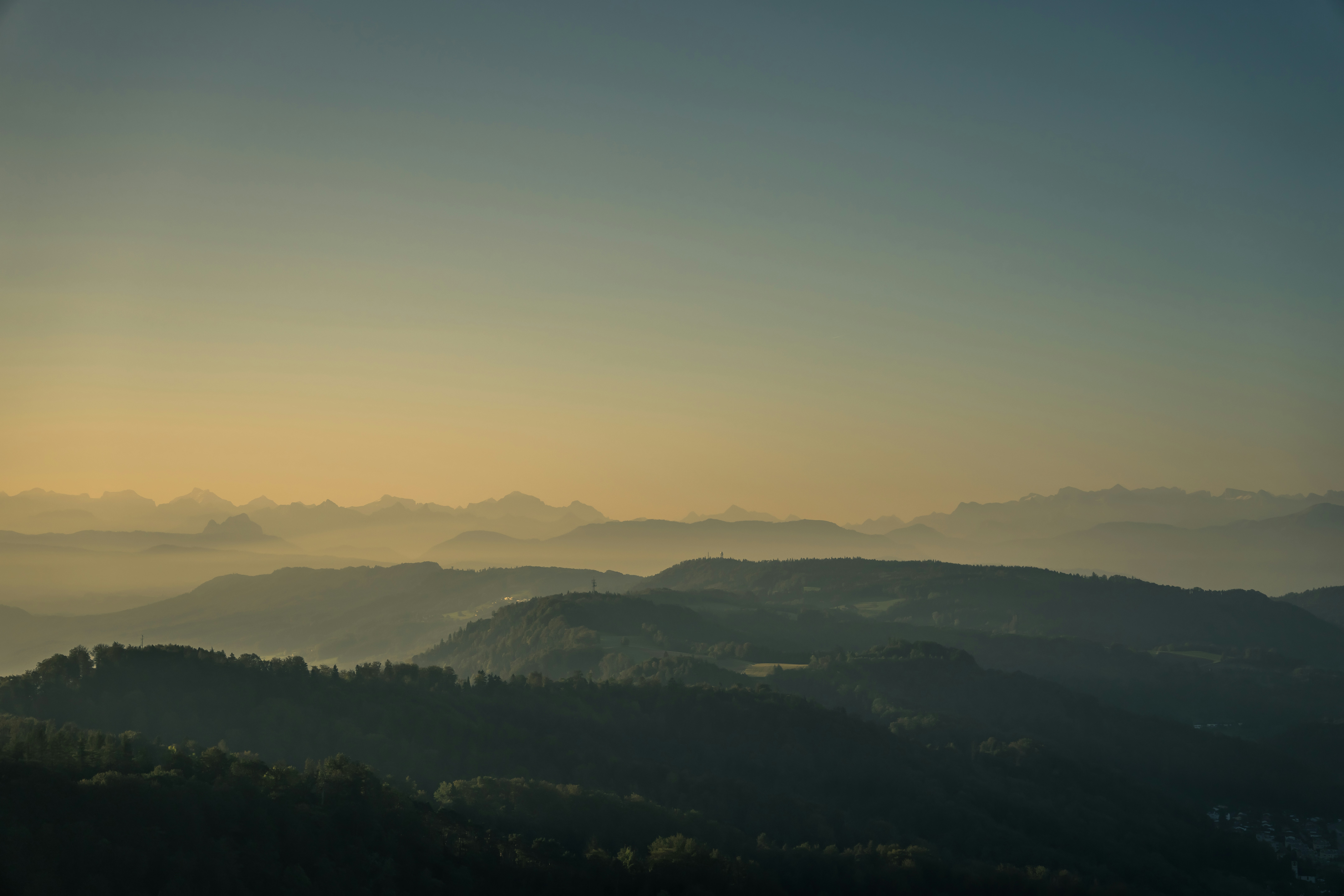 a view of a mountain range at sunset