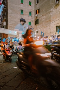 A vibrant street scene near a famous football stadium filled with fans and local culture.