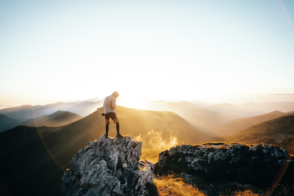 a man standing on top of a mountain