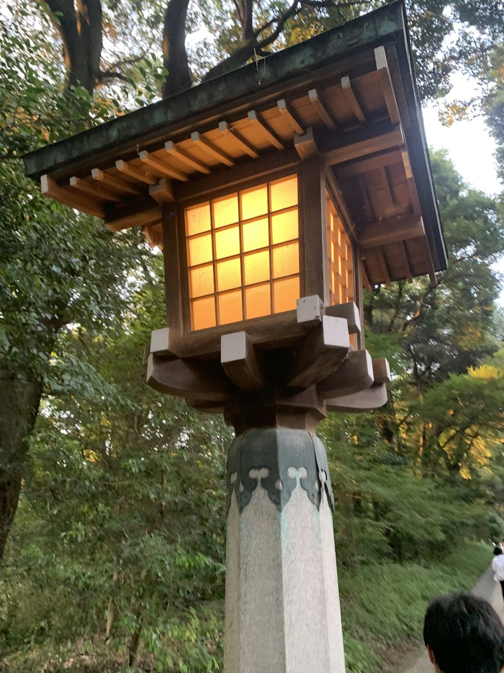 a small wooden structure with a window on top of it