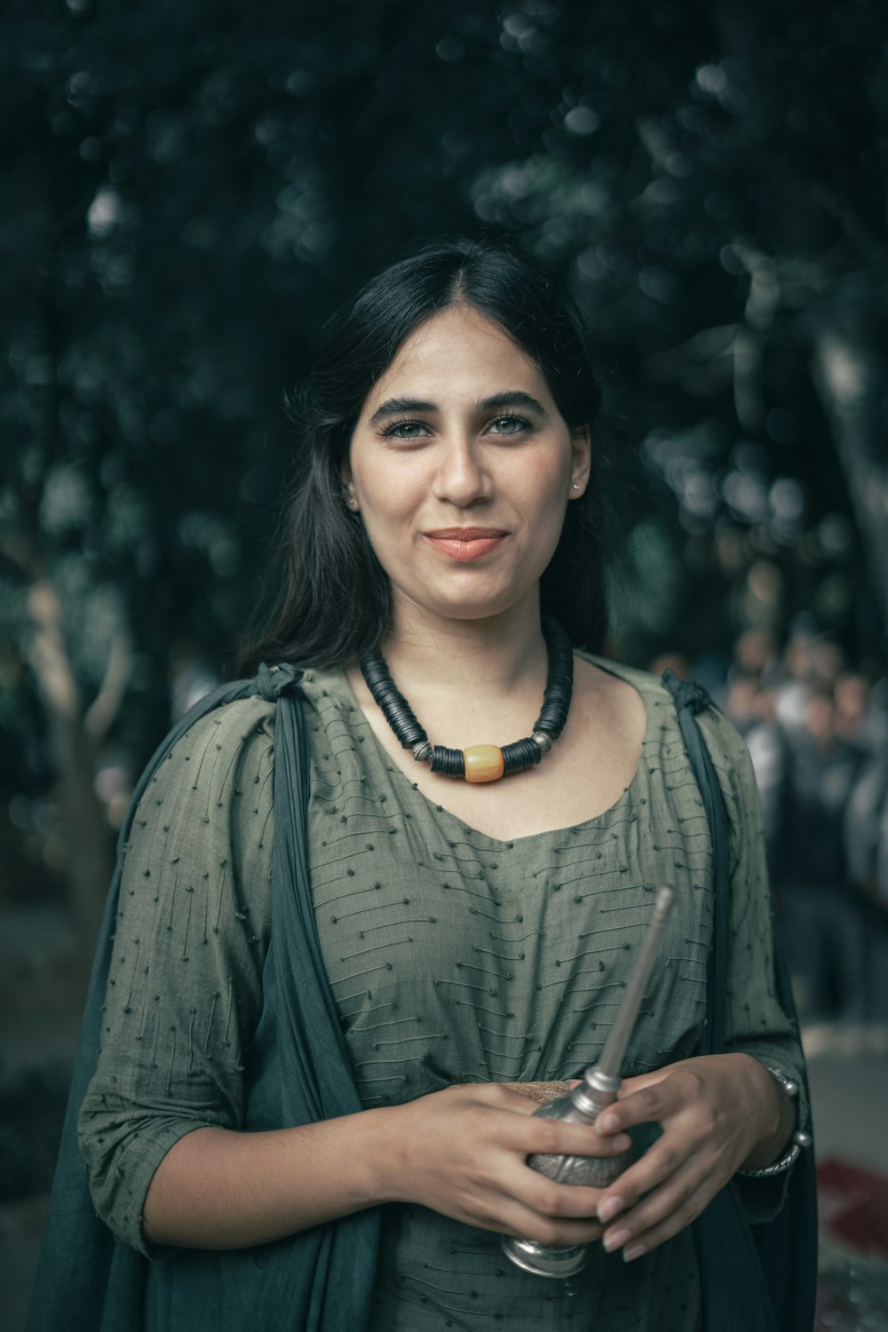 a woman standing in front of a group of people