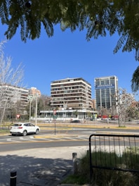 Image depicting rental contracts being signed with a city skyline in the background.