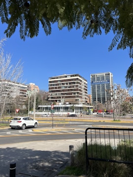 Image depicting rental contracts being signed with a city skyline in the background.