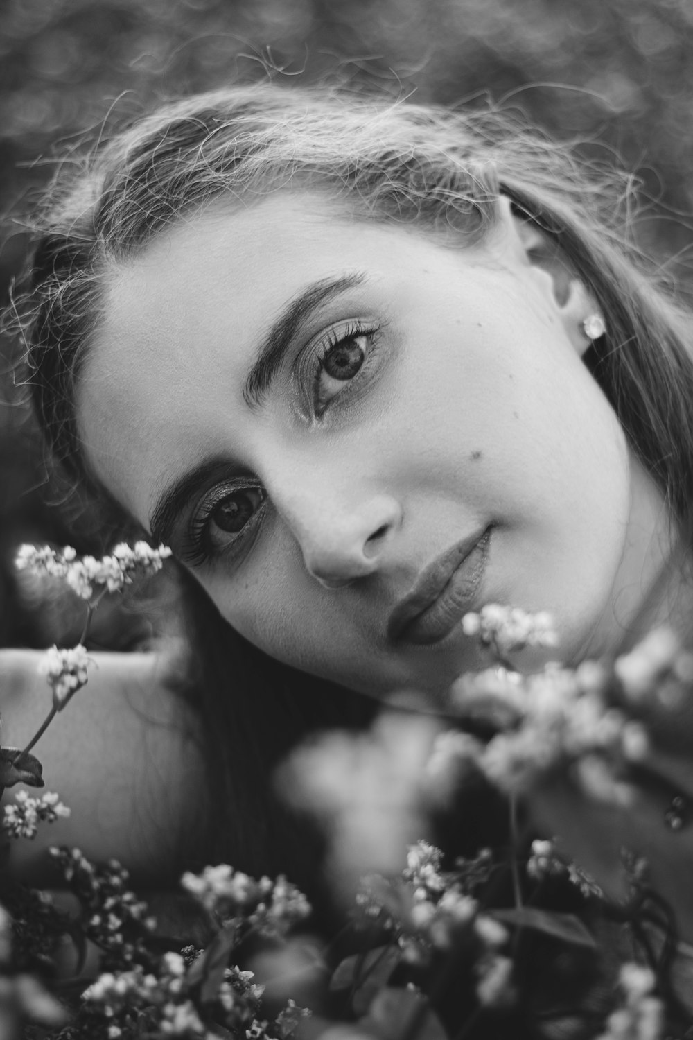 a woman is posing for a black and white photo