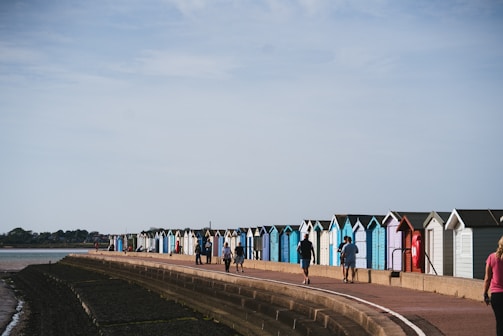 Locals sharing a warm smile during a cultural festival near the beach huts.