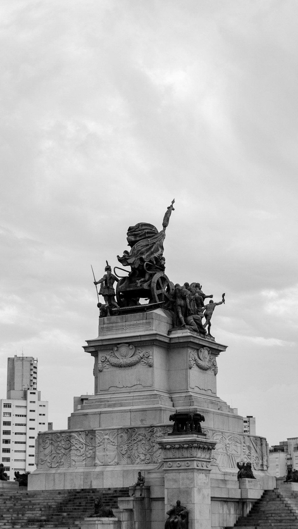 a black and white photo of a statue