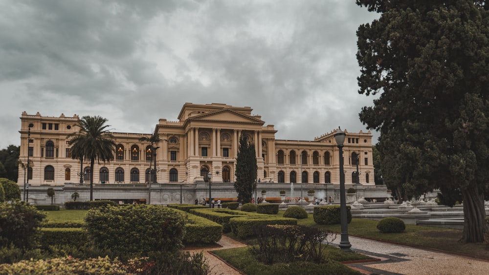 a large building with a lot of trees in front of it