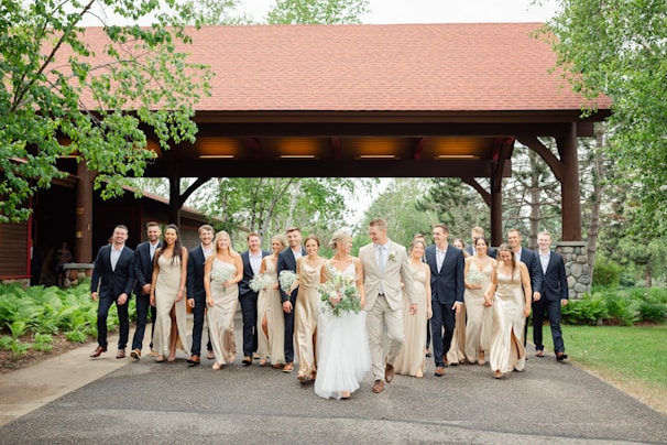 a large group of people standing in front of a gazebo