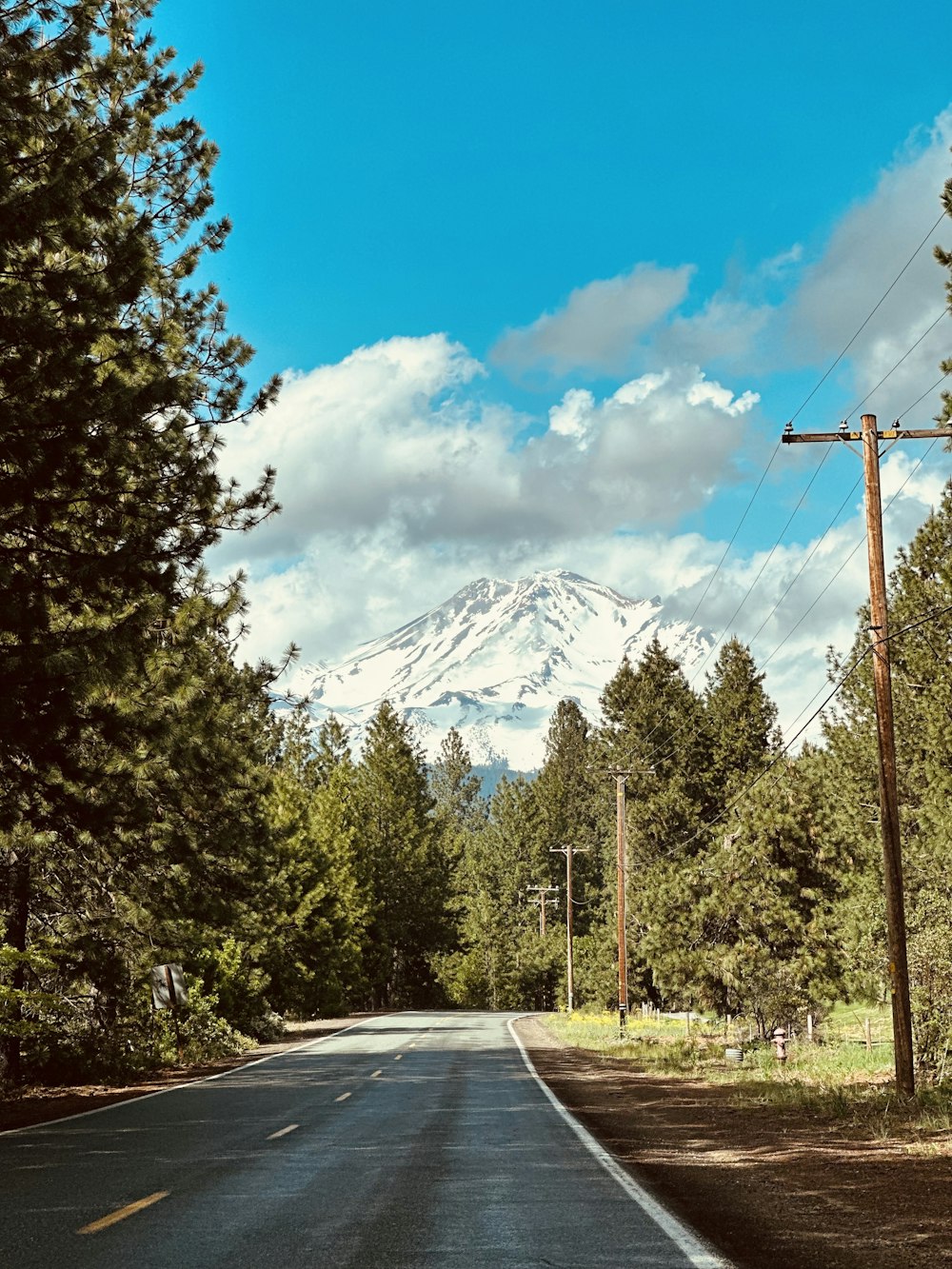 a road with a mountain in the background