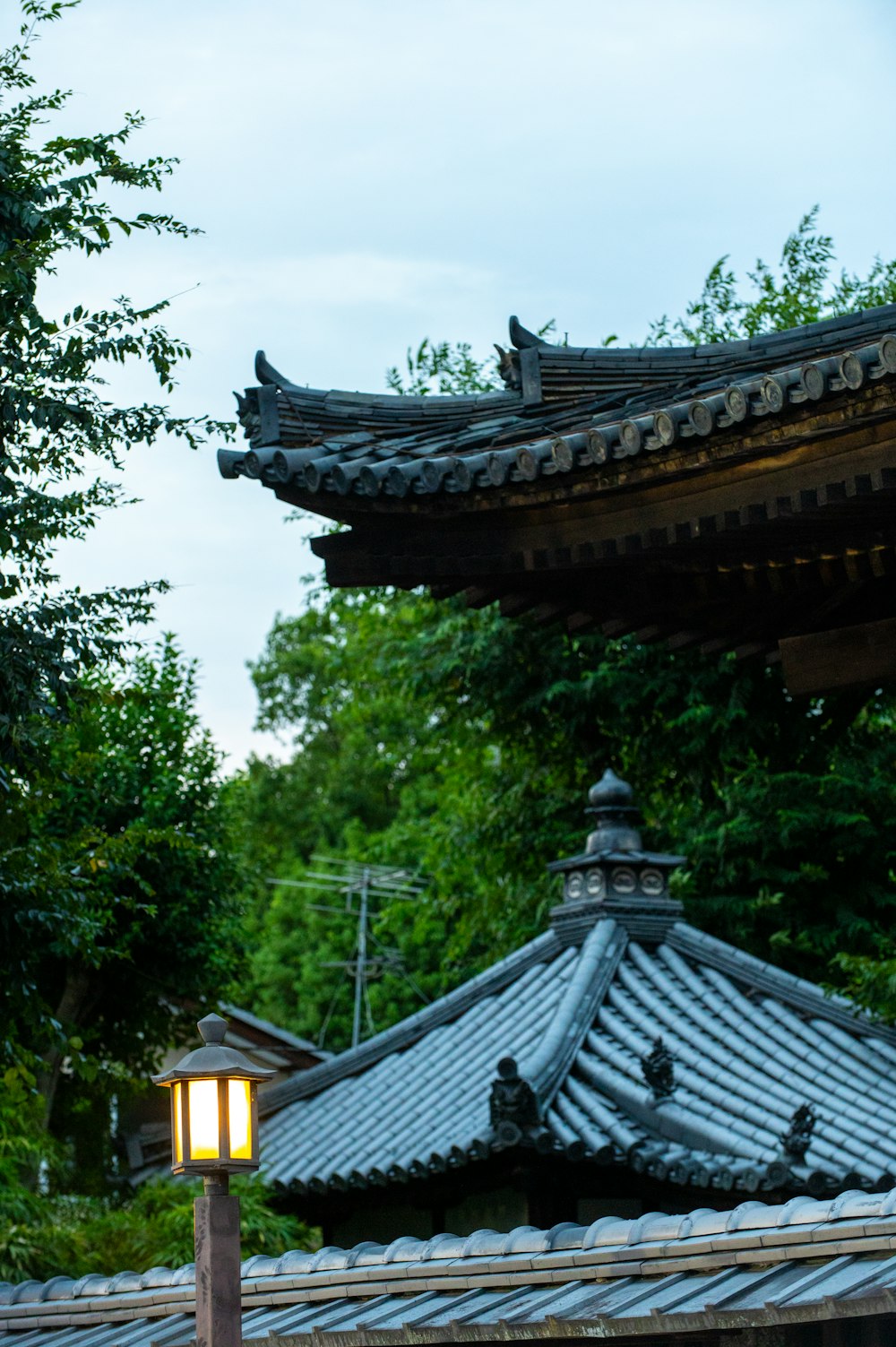 a lamp on a post in front of a building