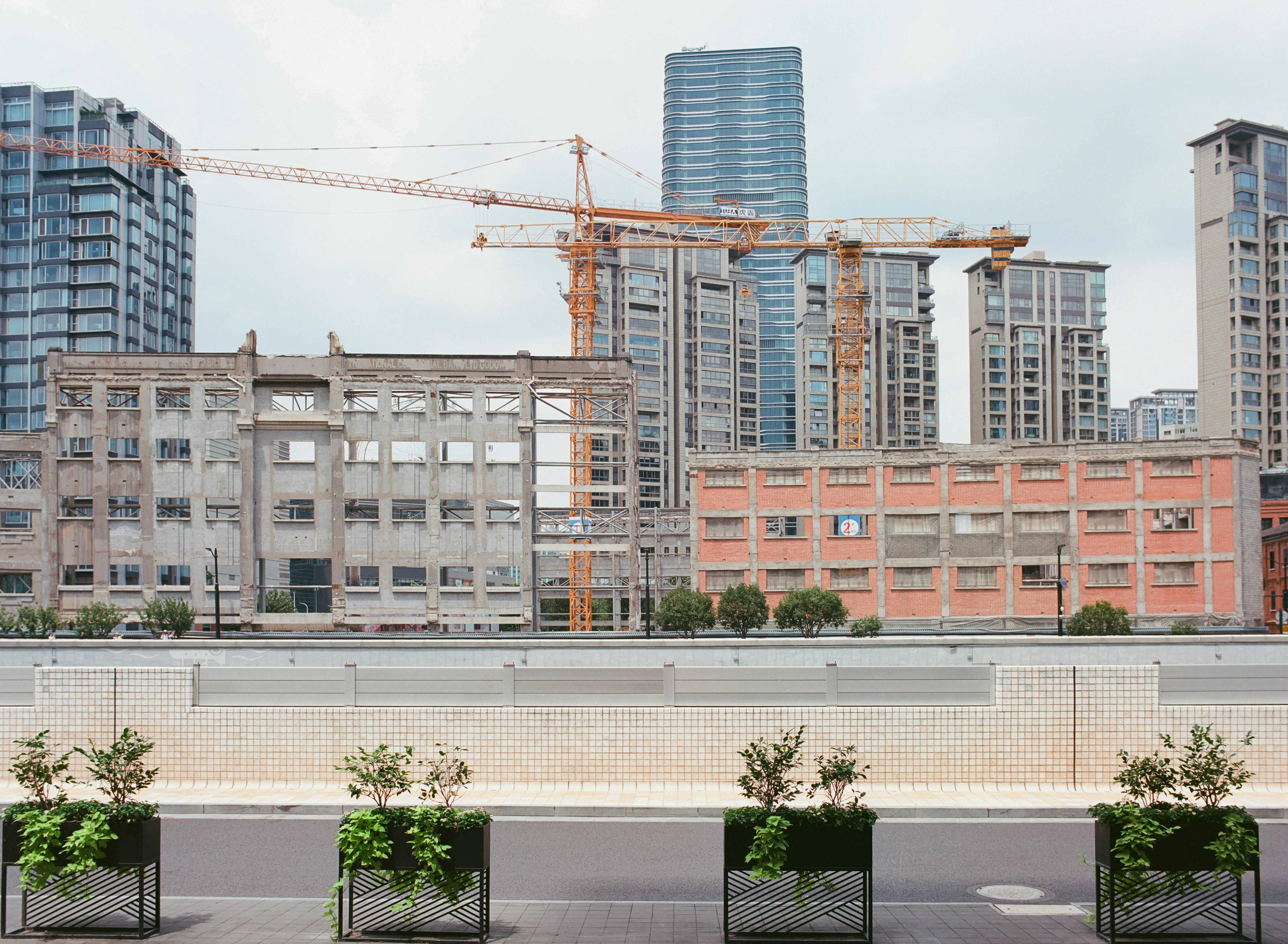 a row of planters on the side of a road