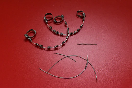 Close-up of orthopedic braces and supports arranged neatly on a wooden surface.