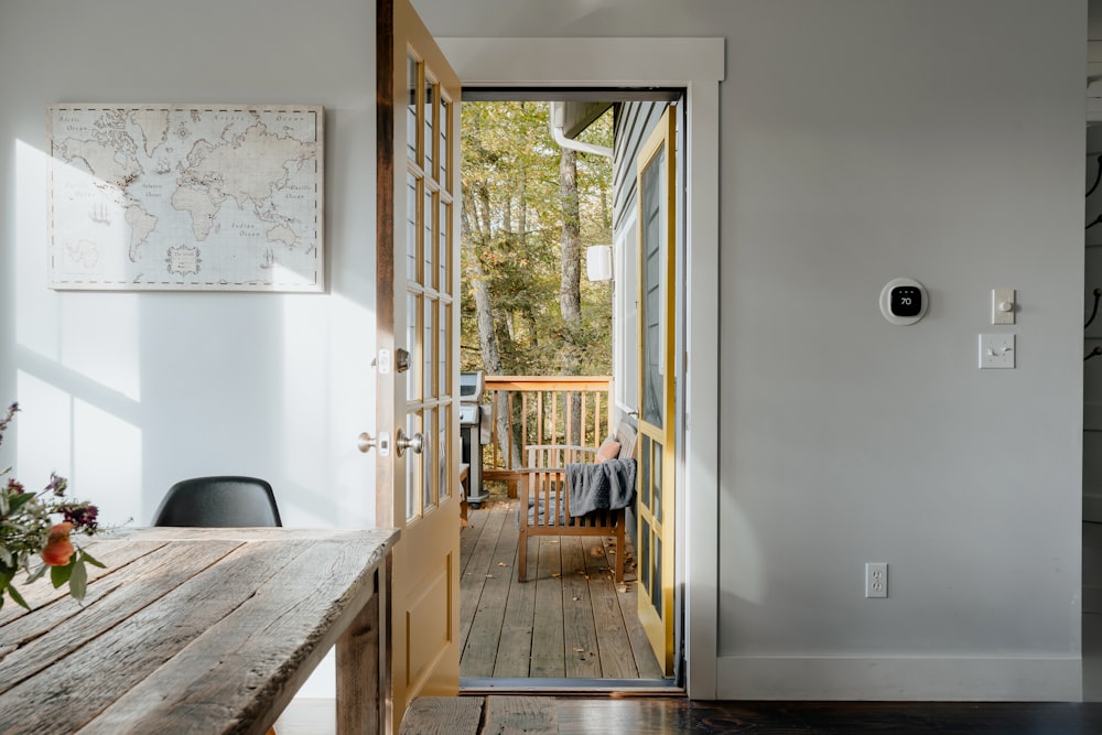 a wooden table sitting next to a doorway