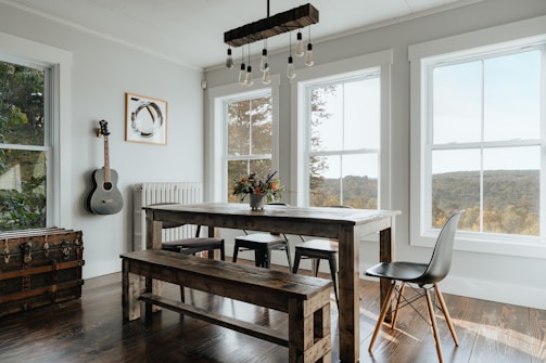 a dining room with a table and a bench