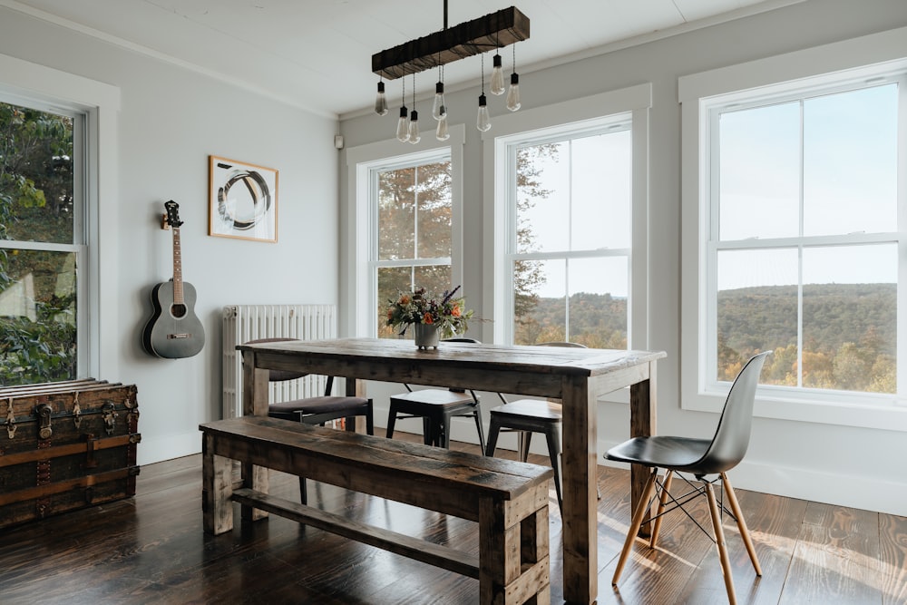 a dining room with a table and a bench