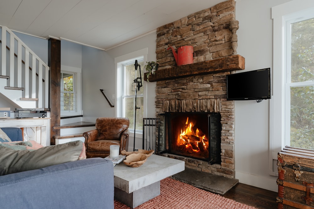 a living room with a couch and a fire place