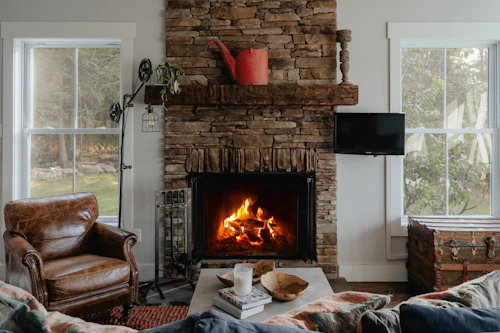 A living room filled with furniture and a fireplace