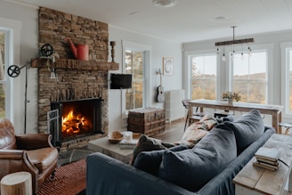 a living room filled with furniture and a fire place