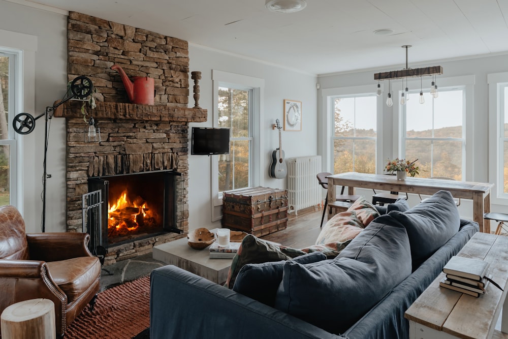 a living room filled with furniture and a fire place