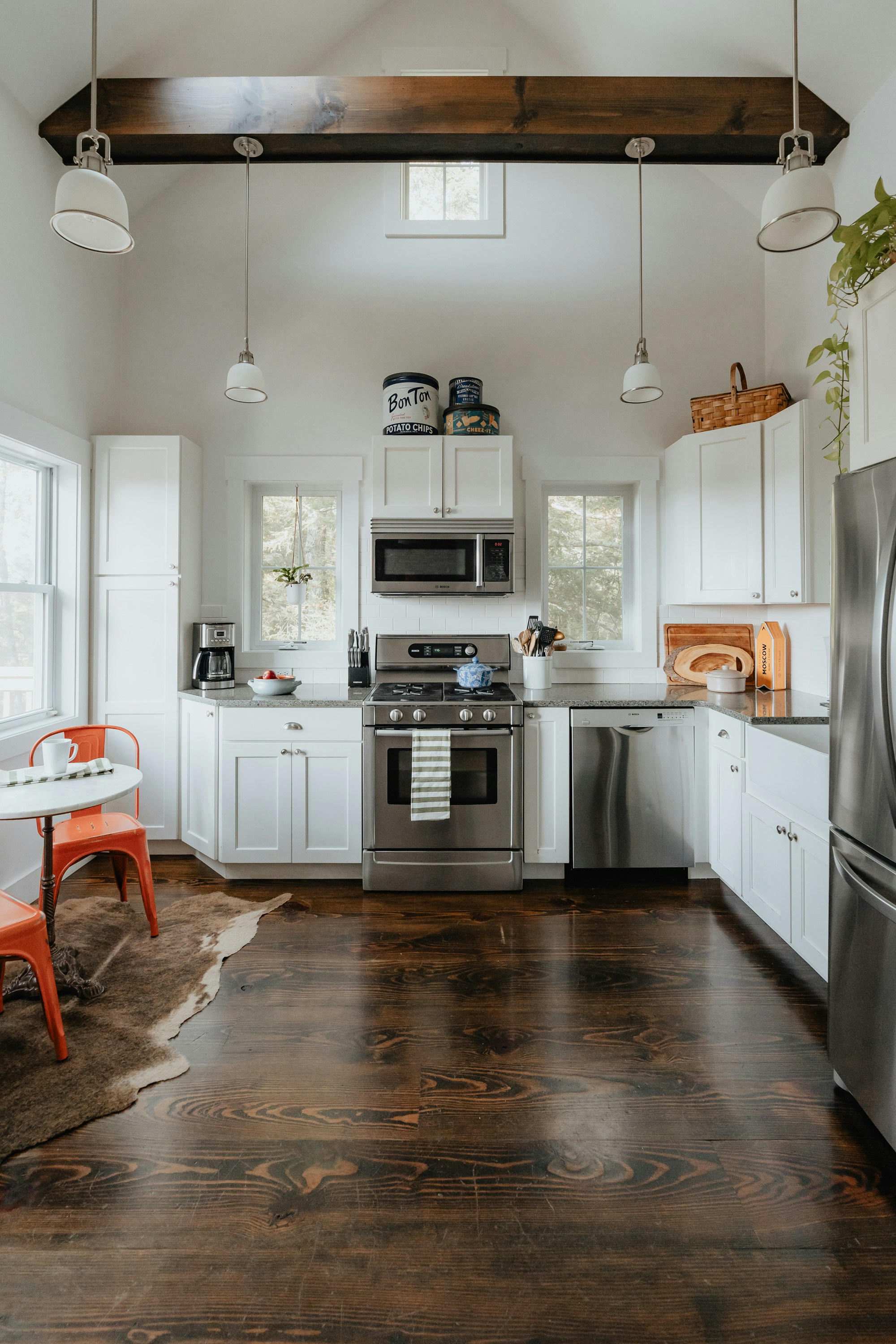 A kitchen with white and stainless steel appliances photo