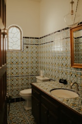 A stylish bathroom featuring intricate tile designs.