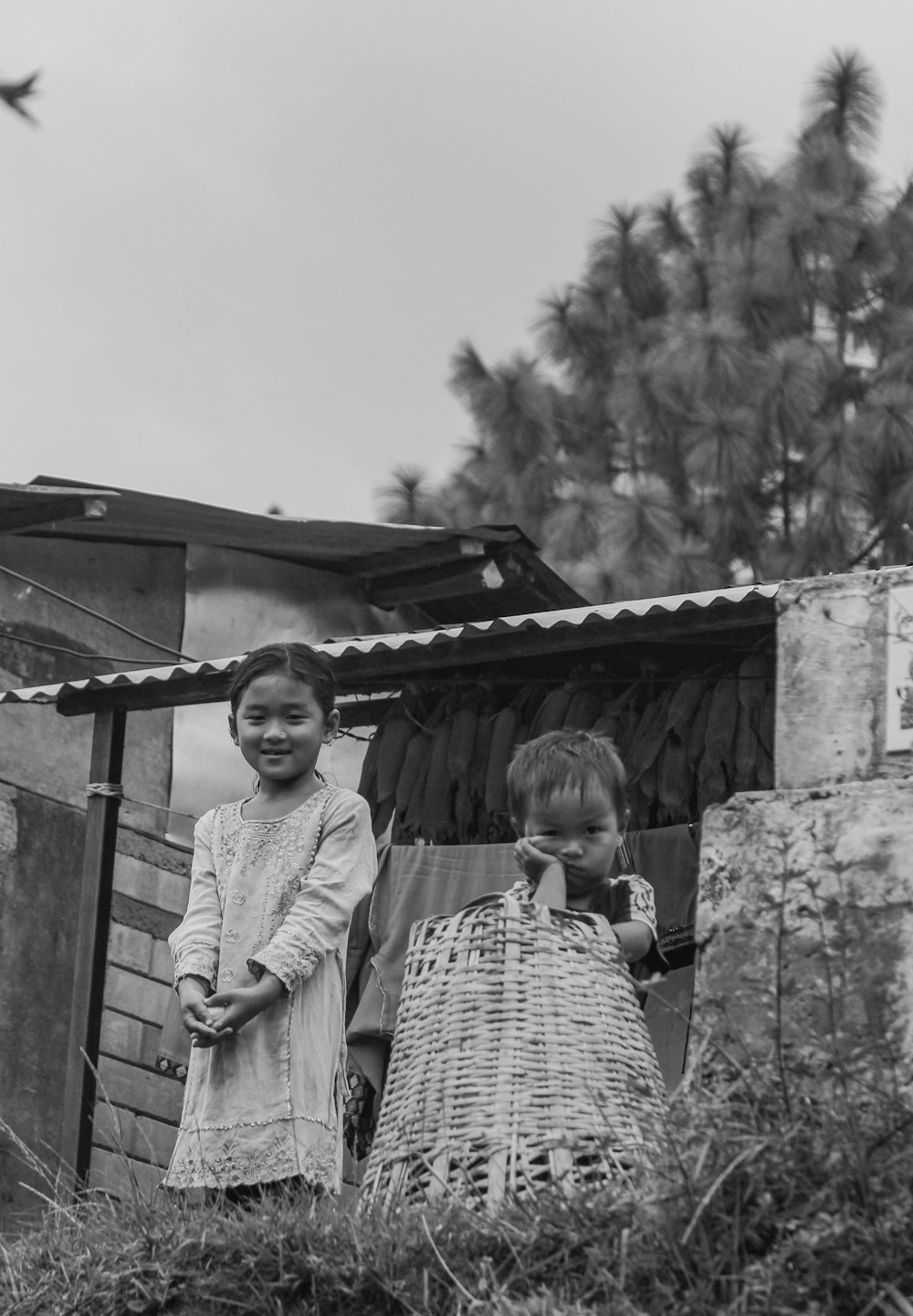 a black and white photo of two children