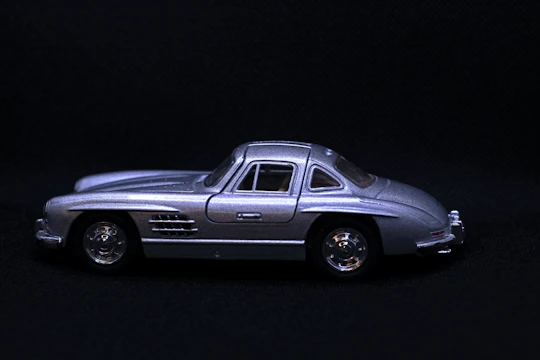 Detailed 3D prototype model of a modern car with minimalist design elements on a dark background.