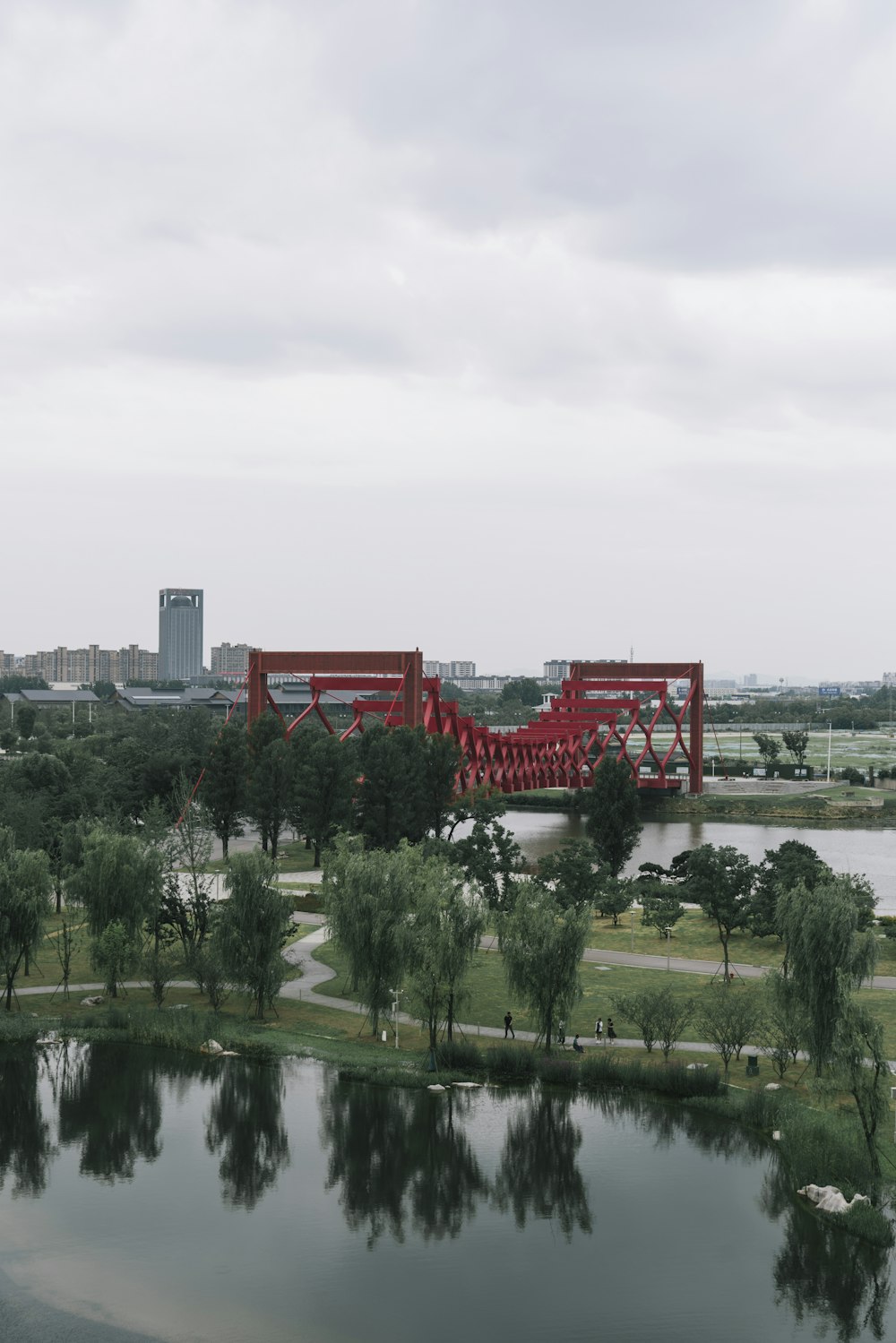 a large red bridge over a body of water