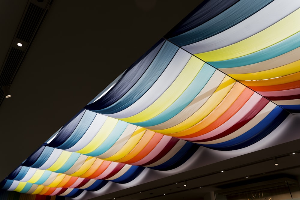 a large multicolored umbrella hanging from the ceiling