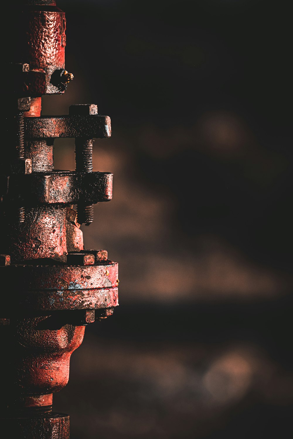a rusted fire hydrant in the middle of the night