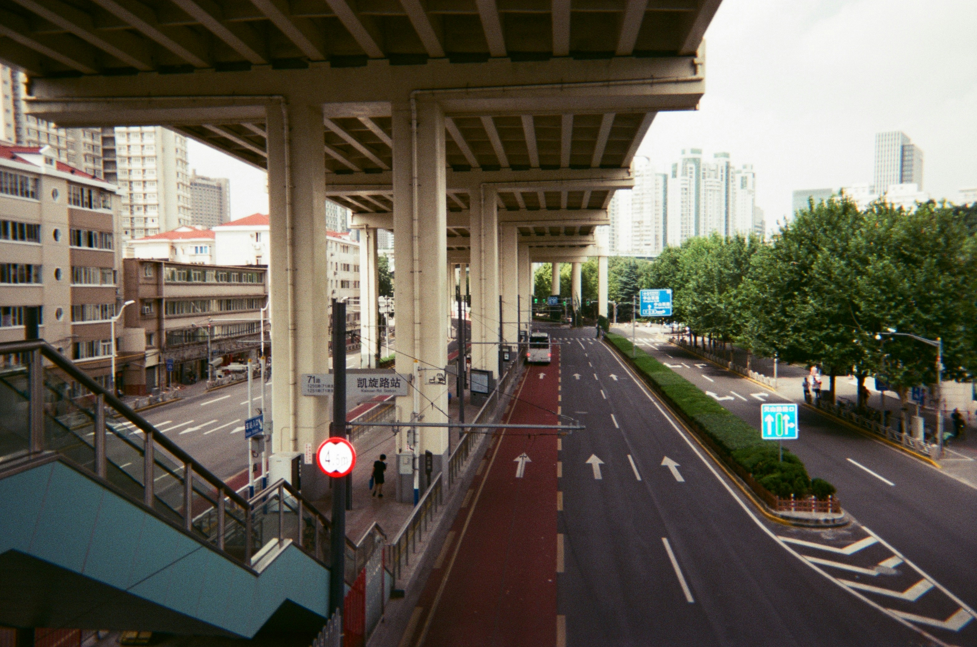 a view of a city street from a bridge