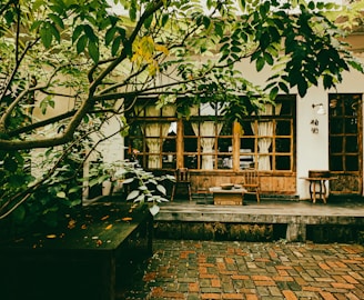 An outdoor patio adorned with recycled decor and greenery.