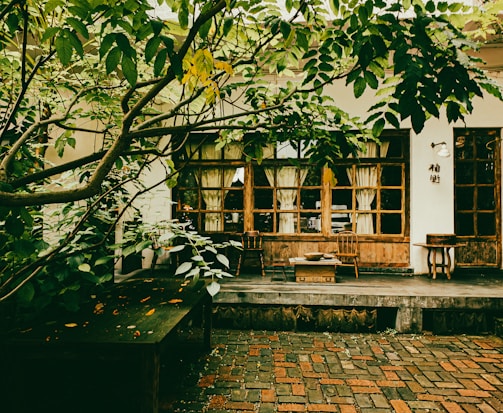 An outdoor patio adorned with recycled decor and greenery.