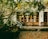 An elegant outdoor patio with comfortable seating and greenery.