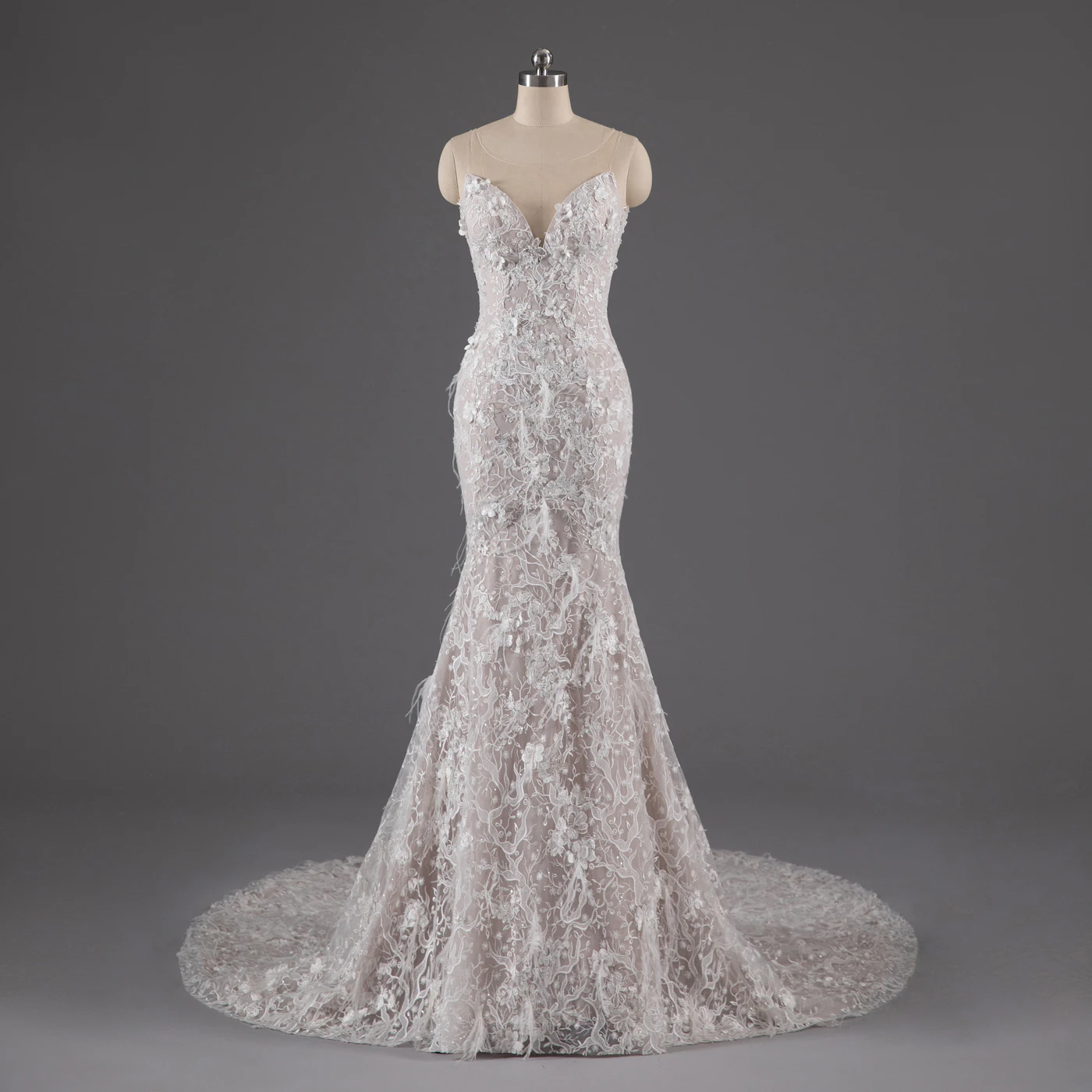 How to style a pearl bridal belt with a mermaid gown — A full-length bride in a fitted mermaid gown with a delicate pearl sash at the waist