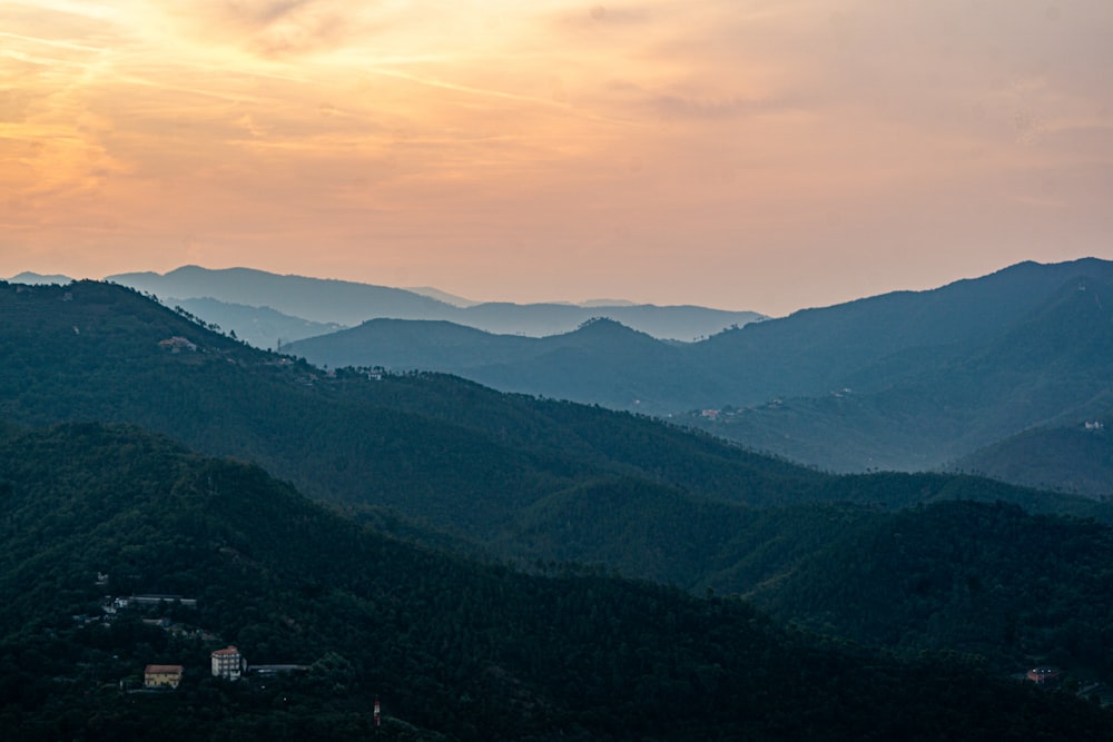 a view of a mountain range at sunset