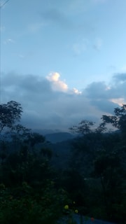 An ebook cover displaying a calming mountain view with gentle clouds.