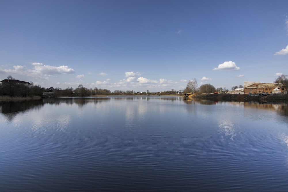 a large body of water surrounded by trees