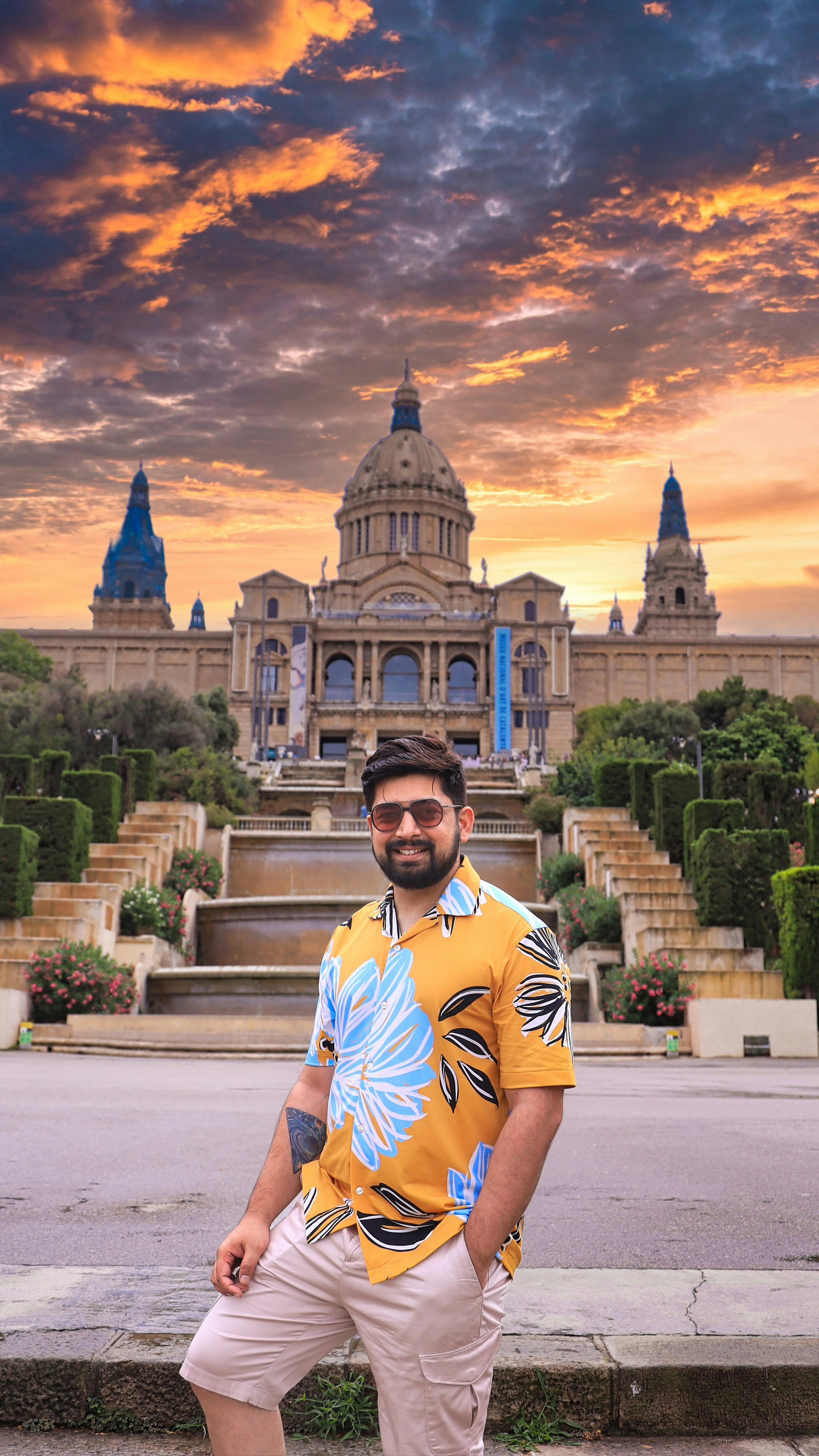 a man standing on a skateboard in front of a building
