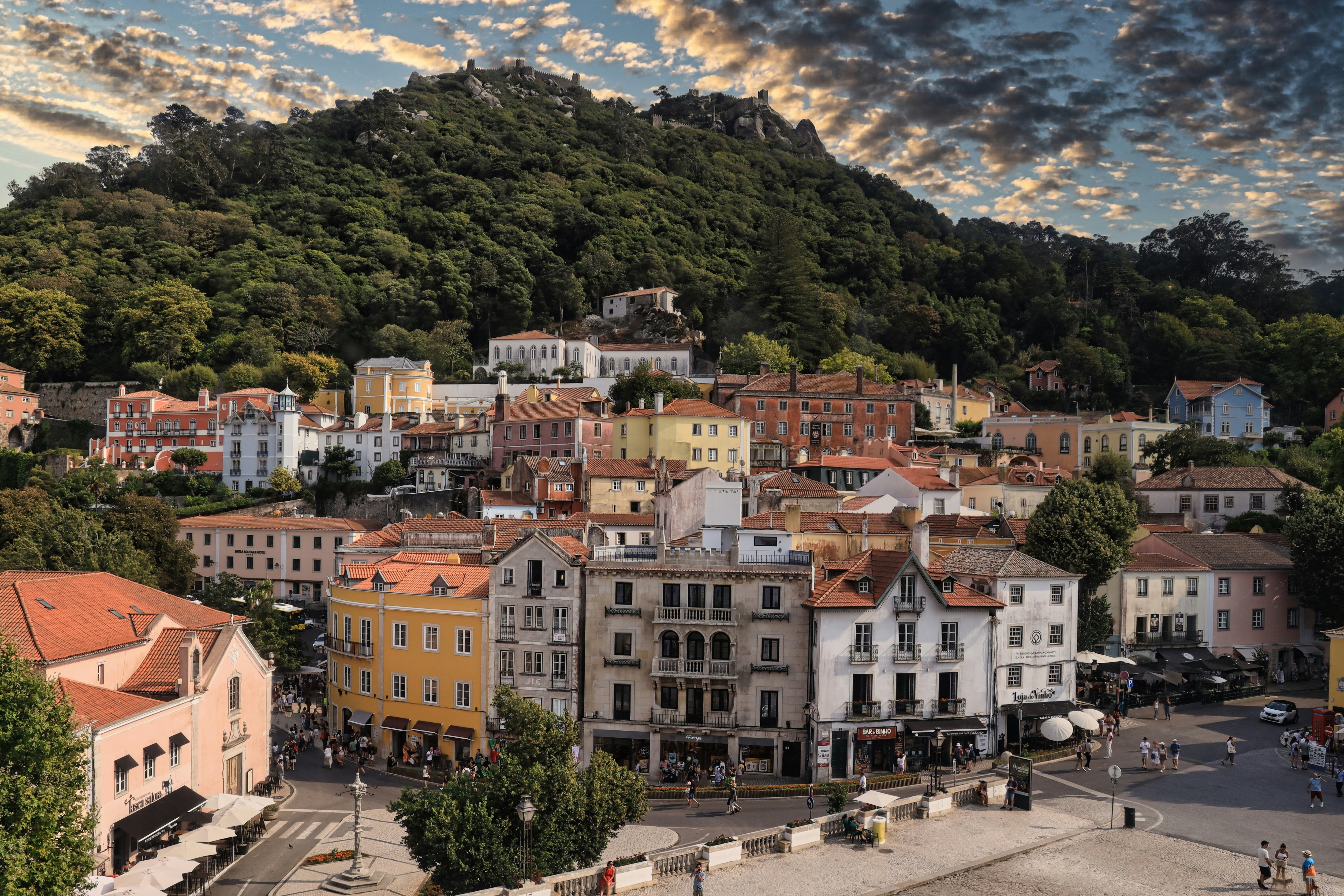a view of a town with a mountain in the background