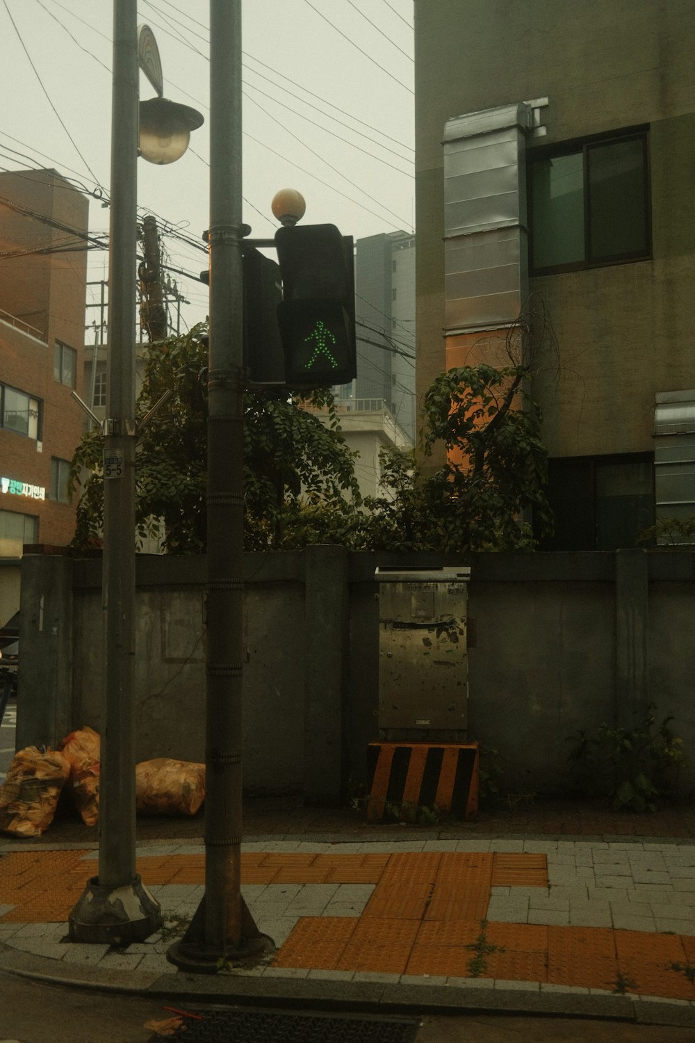 a traffic light sitting on the side of a road