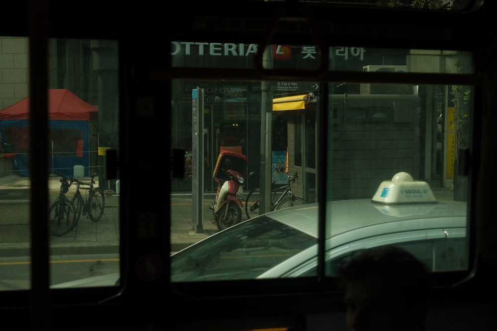 a view of a city street from a bus window