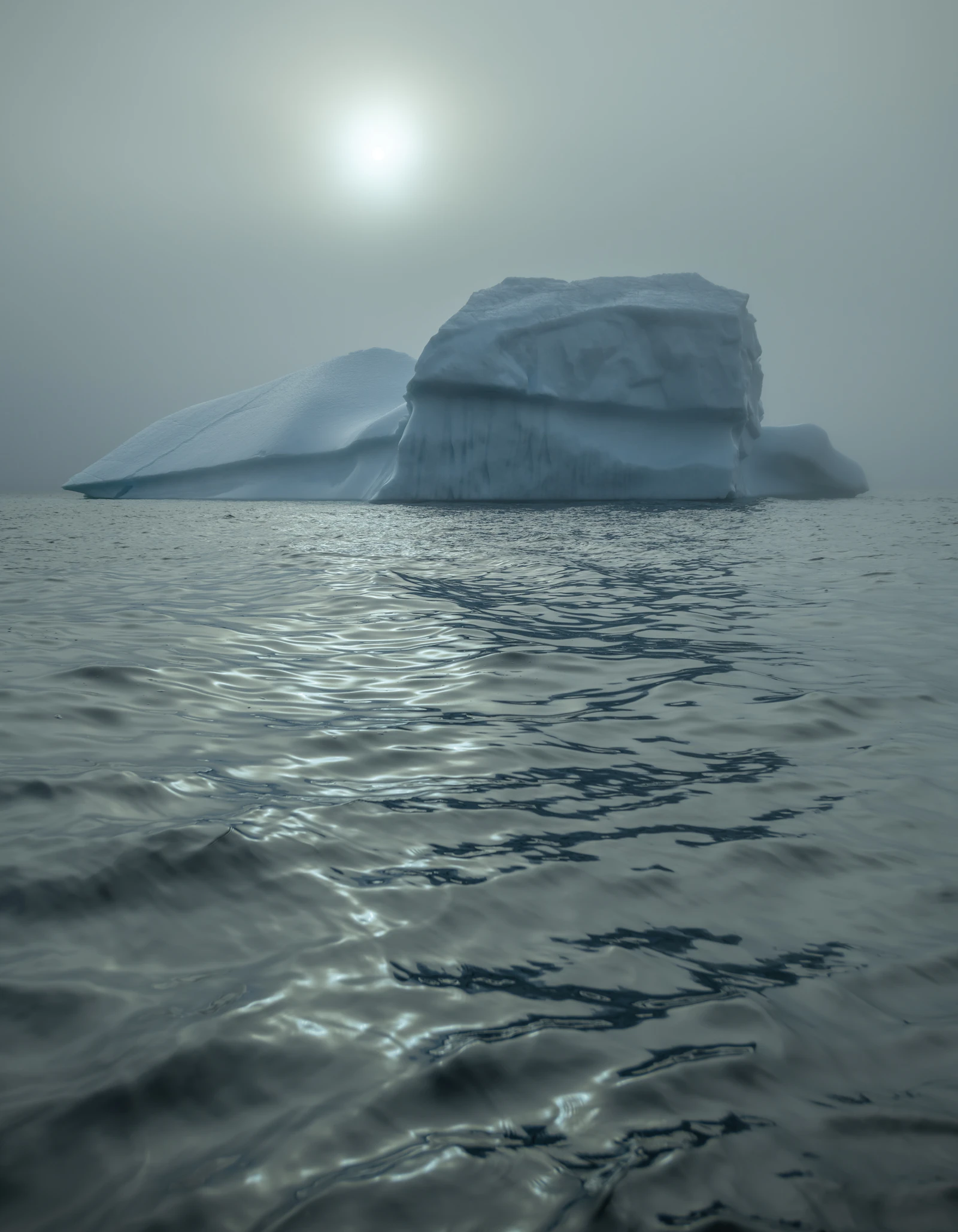 An iceberg drifting in the cold Atlantic off Newfoundland's coast