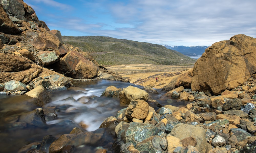 a stream running between two large rocks