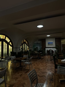 A welcoming dining area bathed in warm dark yellow and brown lighting.