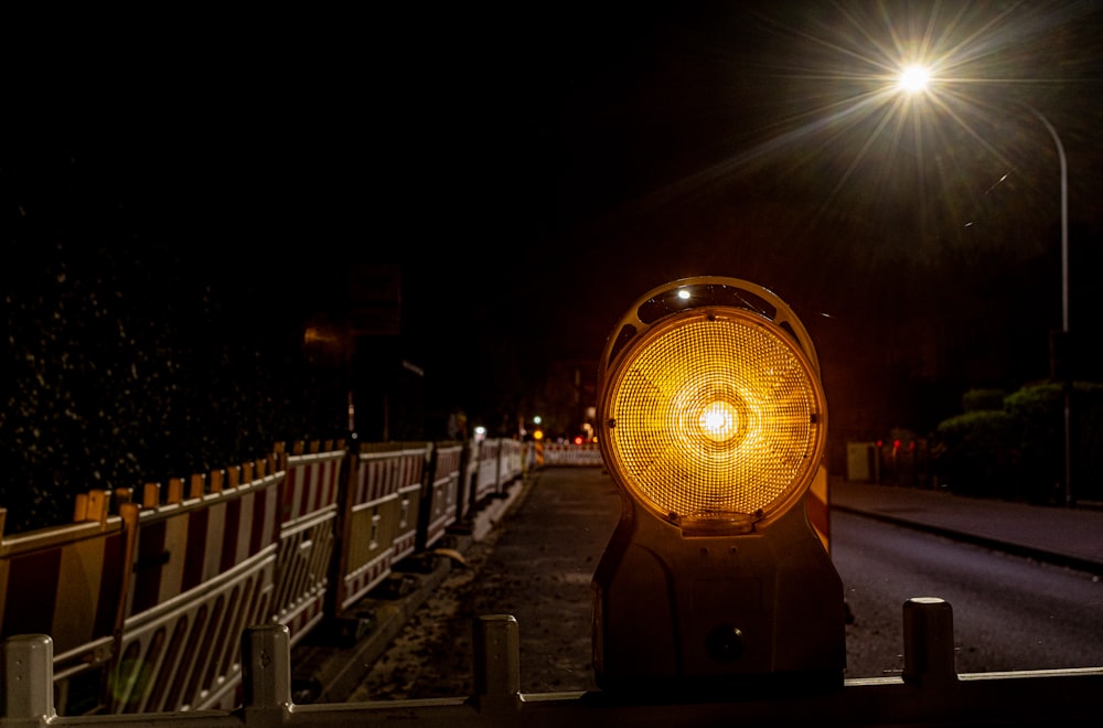 a street light sitting on the side of a road