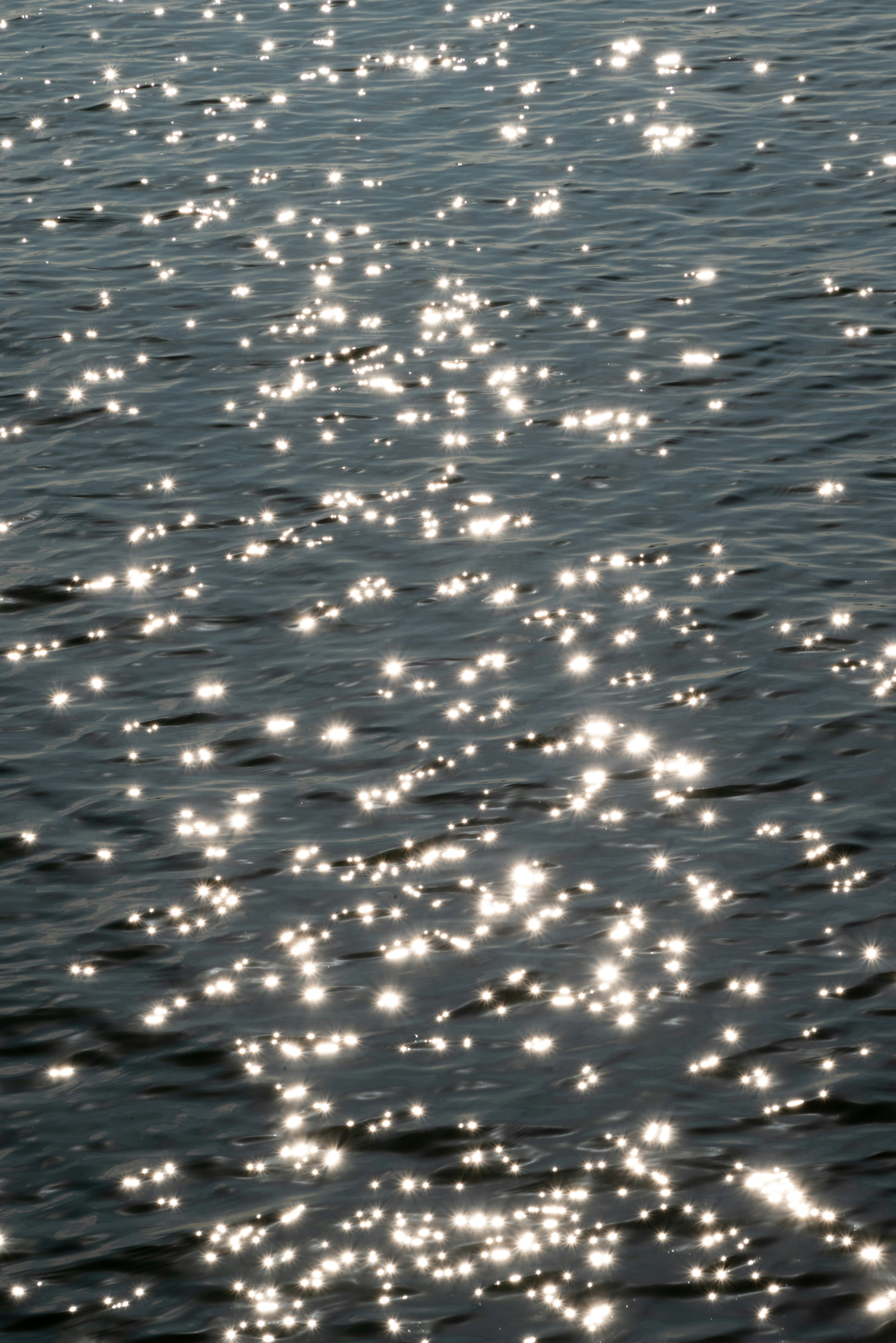 a large body of water filled with lots of white bubbles