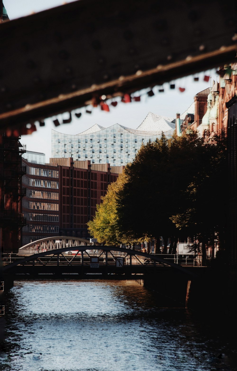 a river running through a city next to tall buildings